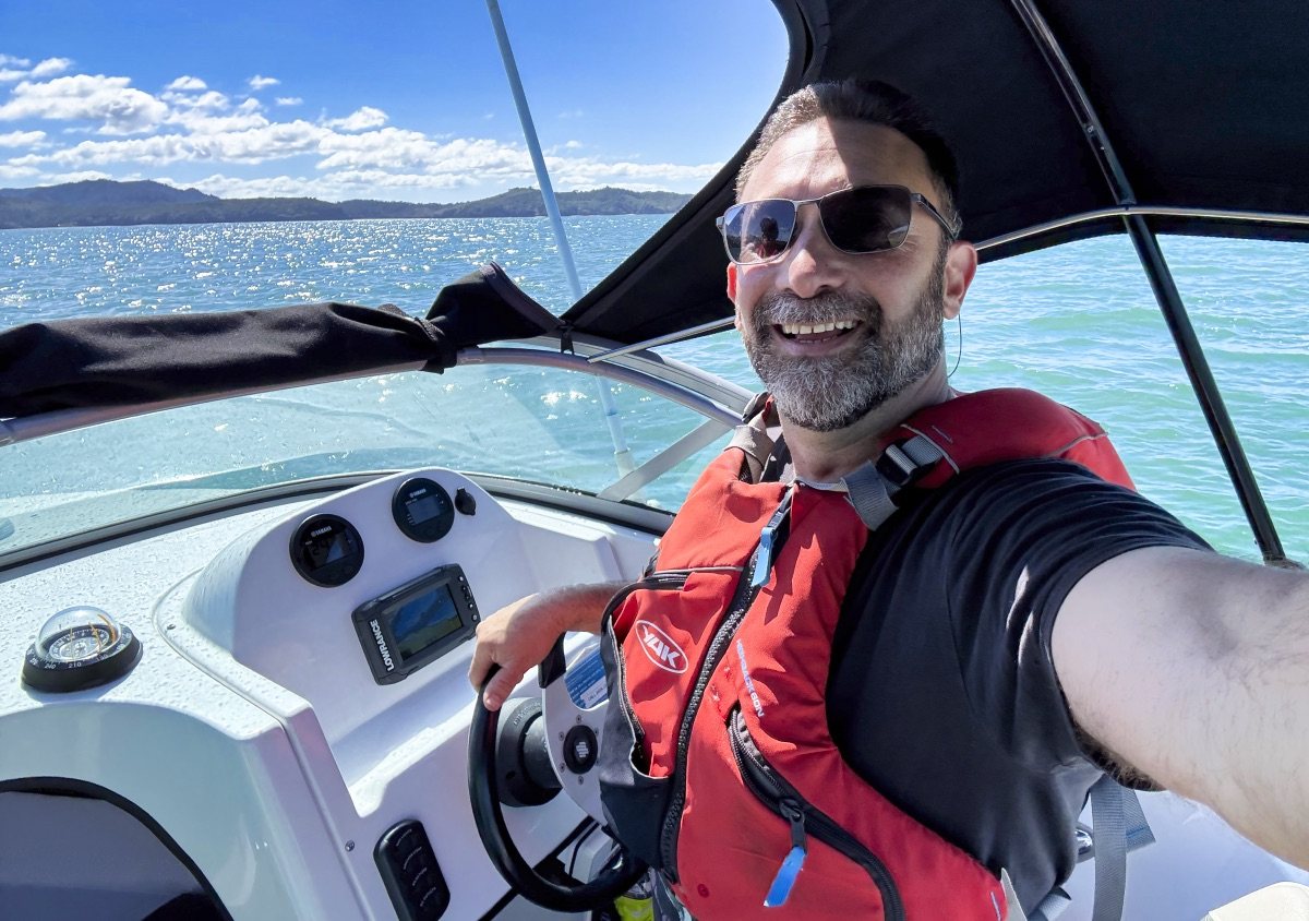 Diego Opatowski at the helm of his boat in New Zealand