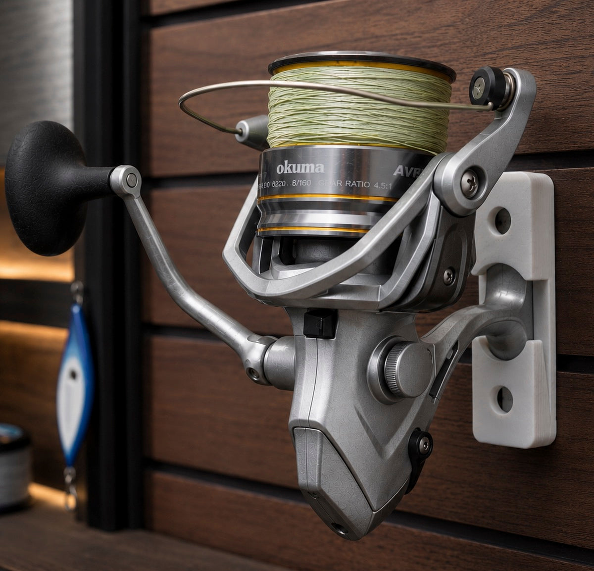 Fishing reel with spool of line on a wooden background