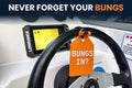 Steering wheel with 'BUNGS IN?' tag and Lowrance device in a vehicle interior.